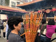 05C People offer incense joss sticks at Wong Tai Sin temple Hong Kong